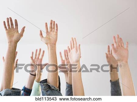 People's hands raised in air View Large Photo Image Stock Image - People's hands raised in air. Fotosearch