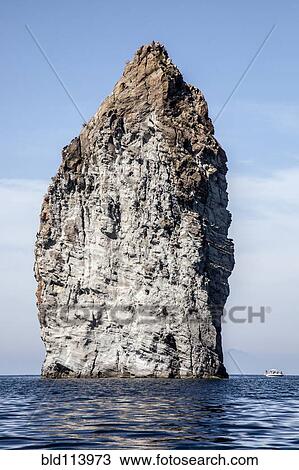 Stock Image - Rock formation in ocean, Isle of Lipari, Sicily, Italy. Fotosearch