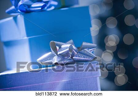 Stacks of wrapped Christmas gifts View Large Photo Image Stock Image - Stacks of wrapped Christmas gifts. Fotosearch