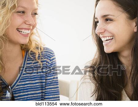 Women laughing together View Large Photo Image Picture - Women laughing together. Fotosearch