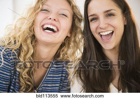 Women laughing together View Large Photo Image Stock Photography - Women laughing together. Fotosearch