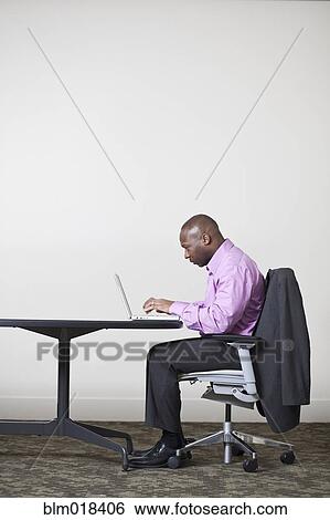 African American businessman using laptop View Large Photo Image Stock Photograph - African American businessman using laptop. Fotosearch
