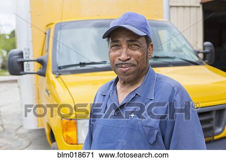 African American worker smiling by truck View Large Photo Image Stock Image - African American worker smiling by truck. Fotosearch