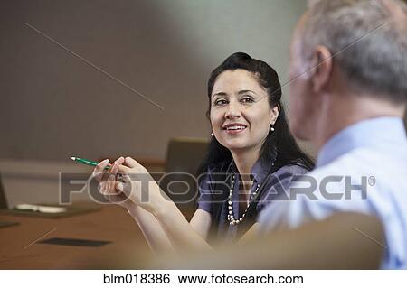 Business people talking in meeting View Large Photo Image Stock Photograph - Business people talking in meeting. Fotosearch