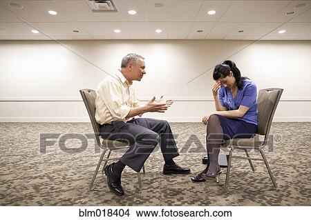Picture - Business people talking in office hallway. Fotosearch