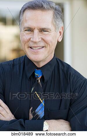 Caucasian businessman smiling View Large Photo Image Stock Photo - Caucasian businessman smiling. Fotosearch