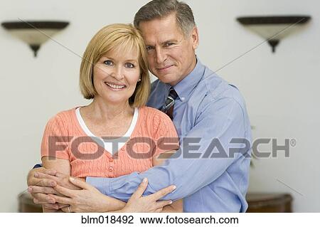 Stock Image - Caucasian couple hugging. Fotosearch