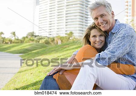 Caucasian couple relaxing in city park View Large Photo Image Picture - Caucasian couple relaxing in city park. Fotosearch
