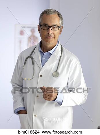Picture - Caucasian doctor smiling in hospital. Fotosearch
