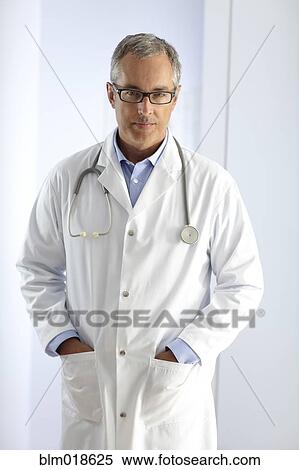 Caucasian doctor smiling in hospital View Large Photo Image Stock Photography - Caucasian doctor smiling in hospital. Fotosearch