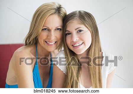 Caucasian mother and daughter smiling together View Large Photo Image Stock Photography - Caucasian mother and daughter smiling together. Fotosearch