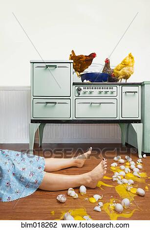Caucasian woman on kitchen floor with broken eggs View Large Photo Image Stock Image - Caucasian woman on kitchen floor with broken eggs. Fotosearch