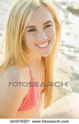 Caucasian woman smiling at beach View Large Photo Image Stock Image - Caucasian woman smiling at beach. Fotosearch