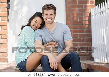 Couple smiling together outdoors View Large Photo Image Picture - Couple smiling together outdoors. Fotosearch