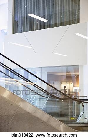Stock Image - Escalator in modern lobby. Fotosearch