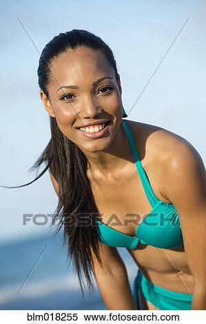 Hispanic woman wearing bikini on beach View Large Photo Image Stock Photography - Hispanic woman wearing bikini on beach. Fotosearch