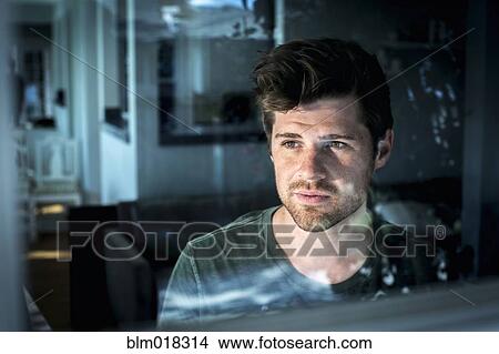 Man looking out window View Large Photo Image Picture - Man looking out window. Fotosearch