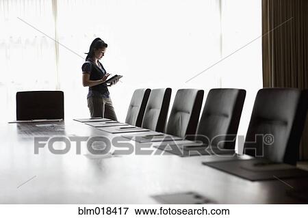 Mixed race businesswoman using tablet computer View Large Photo Image Stock Photo - Mixed race businesswoman using tablet computer. Fotosearch