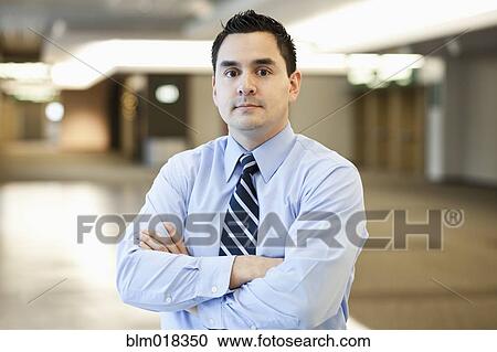 Pacific Islander businessman standing with arms crossed View Large Photo Image Stock Image - Pacific Islander businessman standing with arms crossed. Fotosearch
