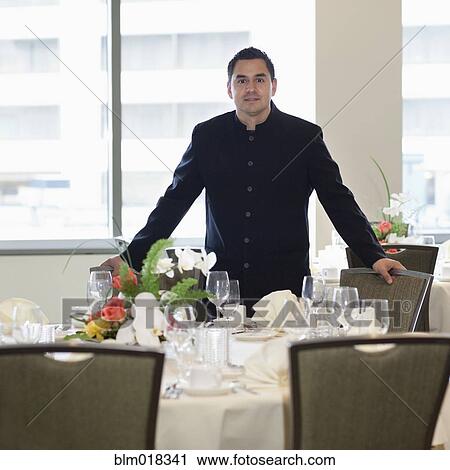 Pacific Islander waiter smiling in dining room View Large Photo Image Stock Image - Pacific Islander waiter smiling in dining room. Fotosearch