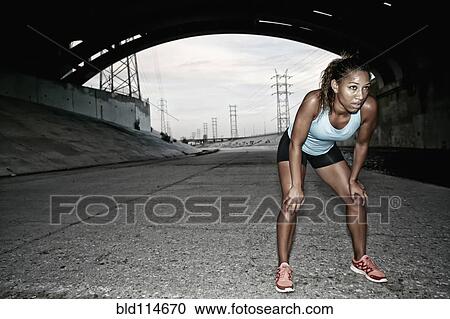 African American runner resting under overpass View Large Photo Image Stock Image - African American runner resting under overpass. Fotosearch