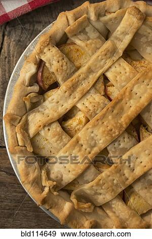 Stock Photo - Apple pie on wooden table. Fotosearch