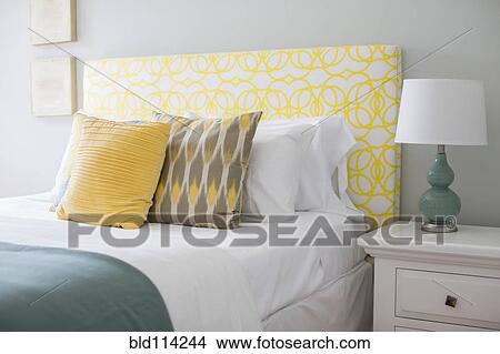 Picture - Bed and nightstand in modern bedroom. Fotosearch