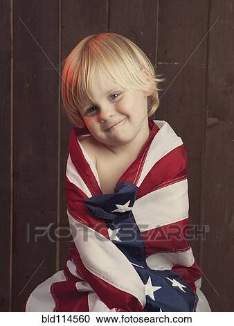 Caucasian boy wrapped in American flag View Large Photo Image Stock Image - Caucasian boy wrapped in American flag. Fotosearch