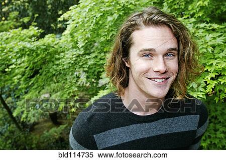 Caucasian man smiling outdoors View Large Photo Image Stock Photography - Caucasian man smiling outdoors. Fotosearch