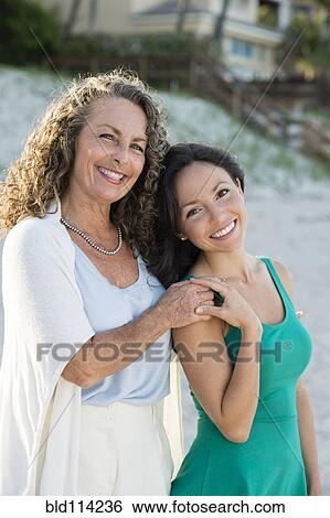 Caucasian mother and daughter smiling View Large Photo Image Stock Photograph - Caucasian mother and daughter smiling. Fotosearch