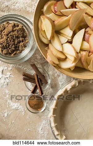 Close up of apples, spices and empty pie shell View Large Photo Image Picture - Close up of apples, spices and empty pie shell. Fotosearch