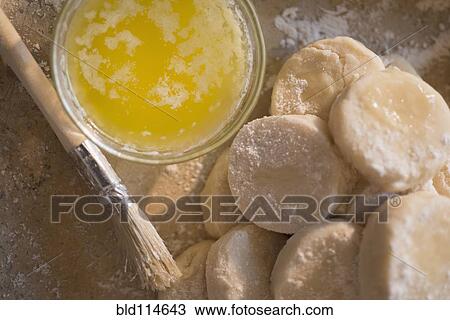 Close up of biscuit rounds and butter View Large Photo Image Stock Image - Close up of biscuit rounds and butter. Fotosearch