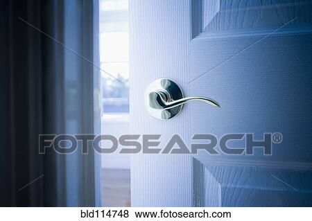 Stock Photo - Close up of handle on open door. Fotosearch