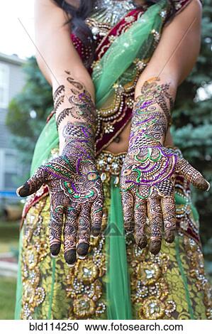 Close up of hands with intricate henna design View Large Photo Image Stock Image - Close up of hands with intricate henna design. Fotosearch
