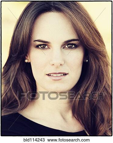 Stock Image - Close up of Hispanic woman's face. Fotosearch