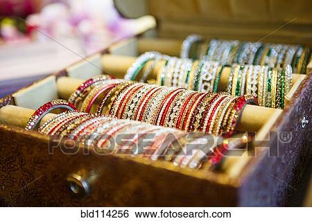 Close up of tray of bangles for sale View Large Photo Image Stock Photograph - Close up of tray of bangles for sale. Fotosearch