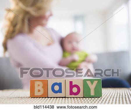 Stock Photo - Close up of wooden blocks spelling 'baby'. Fotosearch