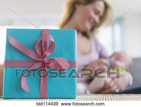 Close up of wrapped gift on table View Large Photo Image Stock Photo - Close up of wrapped gift on table. Fotosearch