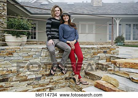 Picture - Couple smiling together outdoors. Fotosearch