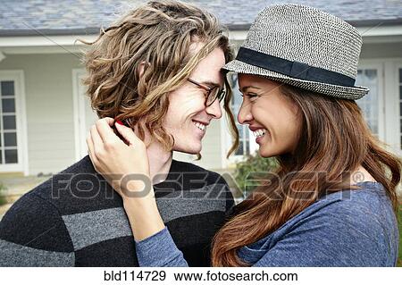 Couple smiling together outdoors View Large Photo Image Stock Photo - Couple smiling together outdoors. Fotosearch