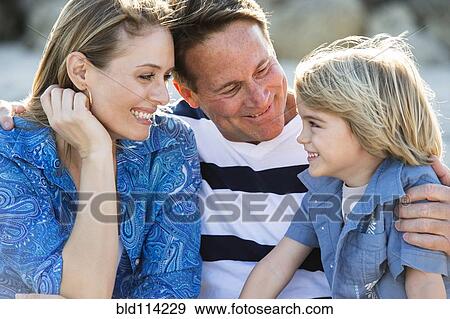 Family smiling together outdoors View Large Photo Image Stock Photo - Family smiling together outdoors. Fotosearch