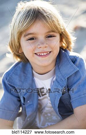 Hispanic boy smiling outdoors View Large Photo Image Stock Photo - Hispanic boy smiling outdoors. Fotosearch