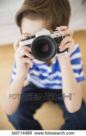 Hispanic boy taking pictures View Large Photo Image Stock Photo - Hispanic boy taking pictures. Fotosearch