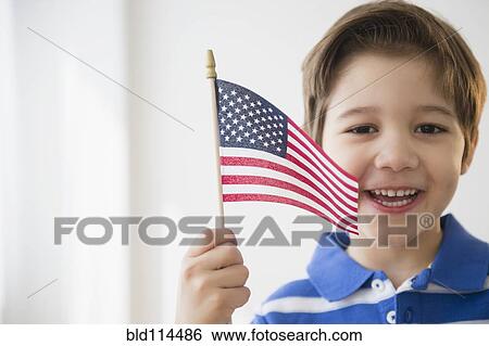 Stock Photograph - Hispanic boy waving American flag. Fotosearch