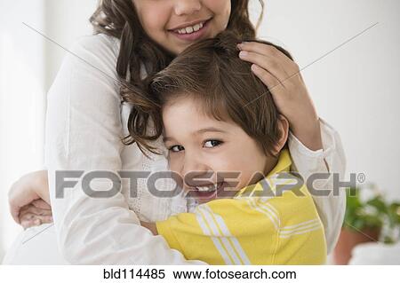 Hispanic children hugging View Large Photo Image Stock Photography - Hispanic children hugging. Fotosearch