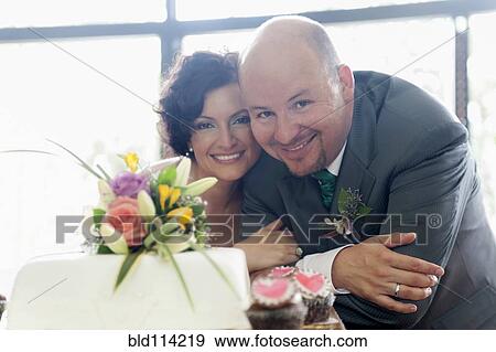 Stock Photo - Hispanic couple smiling at wedding. Fotosearch