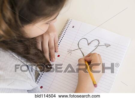 Hispanic girl doodling heart and arrow View Large Photo Image Picture - Hispanic girl doodling heart and arrow. Fotosearch