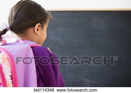 Stock Photo - Hispanic girl wearing backpack. Fotosearch