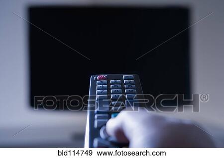 Hispanic man using remote control View Large Photo Image Stock Photo - Hispanic man using remote control. Fotosearch