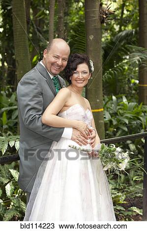 Hispanic newlywed couple smiling View Large Photo Image Stock Image - Hispanic newlywed couple smiling. Fotosearch